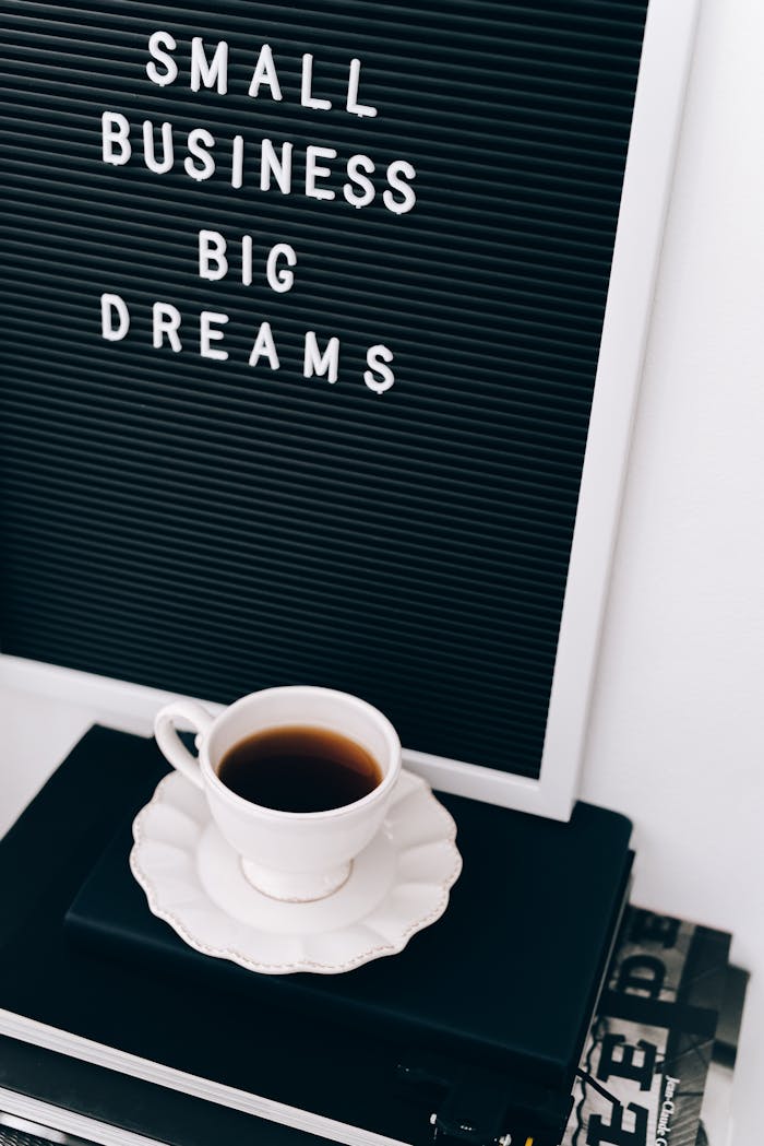 about-us Motivational letter board with coffee cup, ideal for entrepreneurs.
